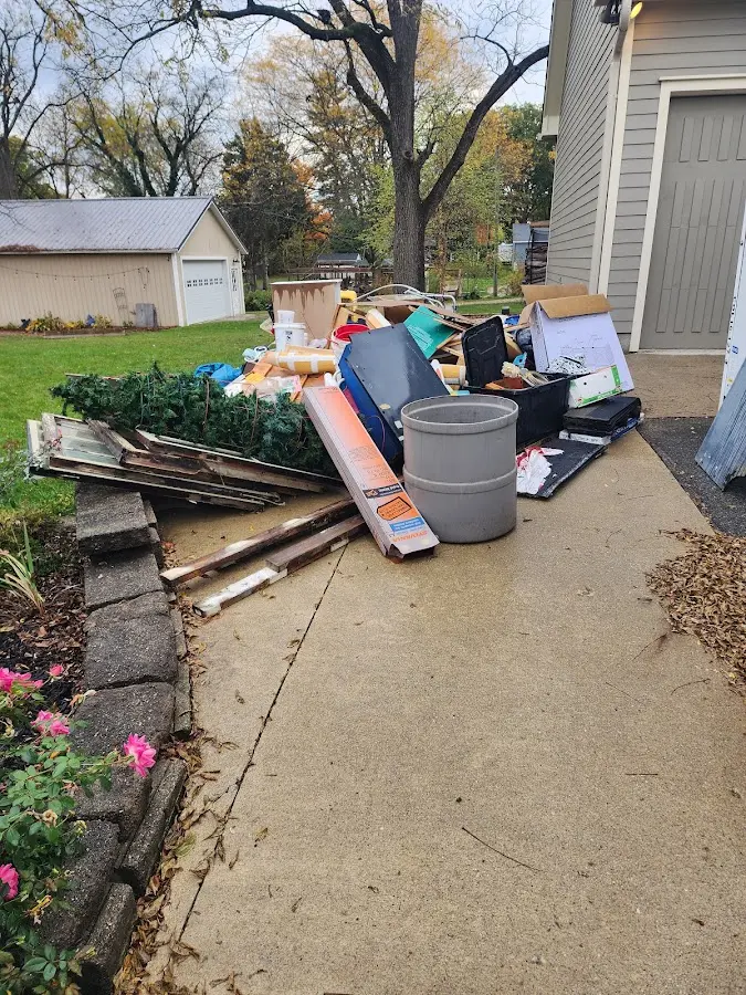 Dumpster being loaded with debris for Commercial Dumpster Rental in Southeast Arcadia